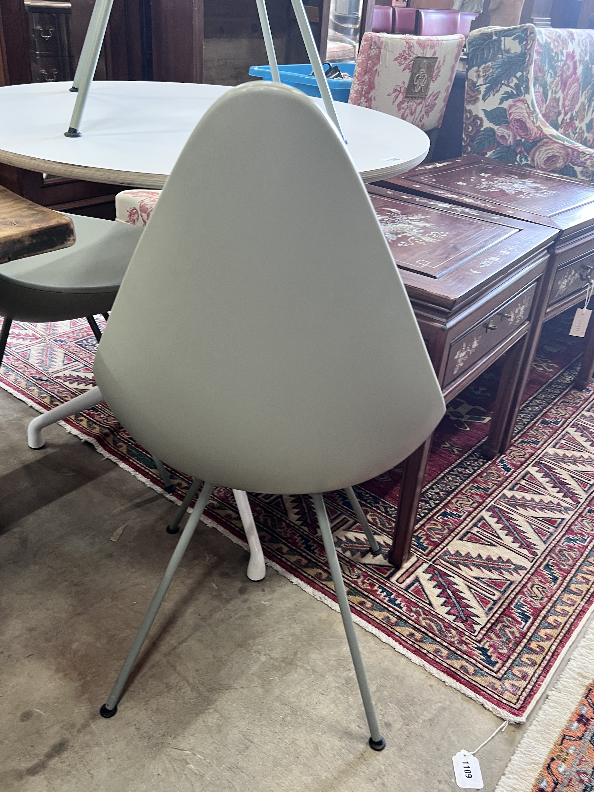 Arne Jacobsen for Fritz Hansen, three 'drop' chairs and a Hay Productions circular table, diameter 80cm, height 74cm